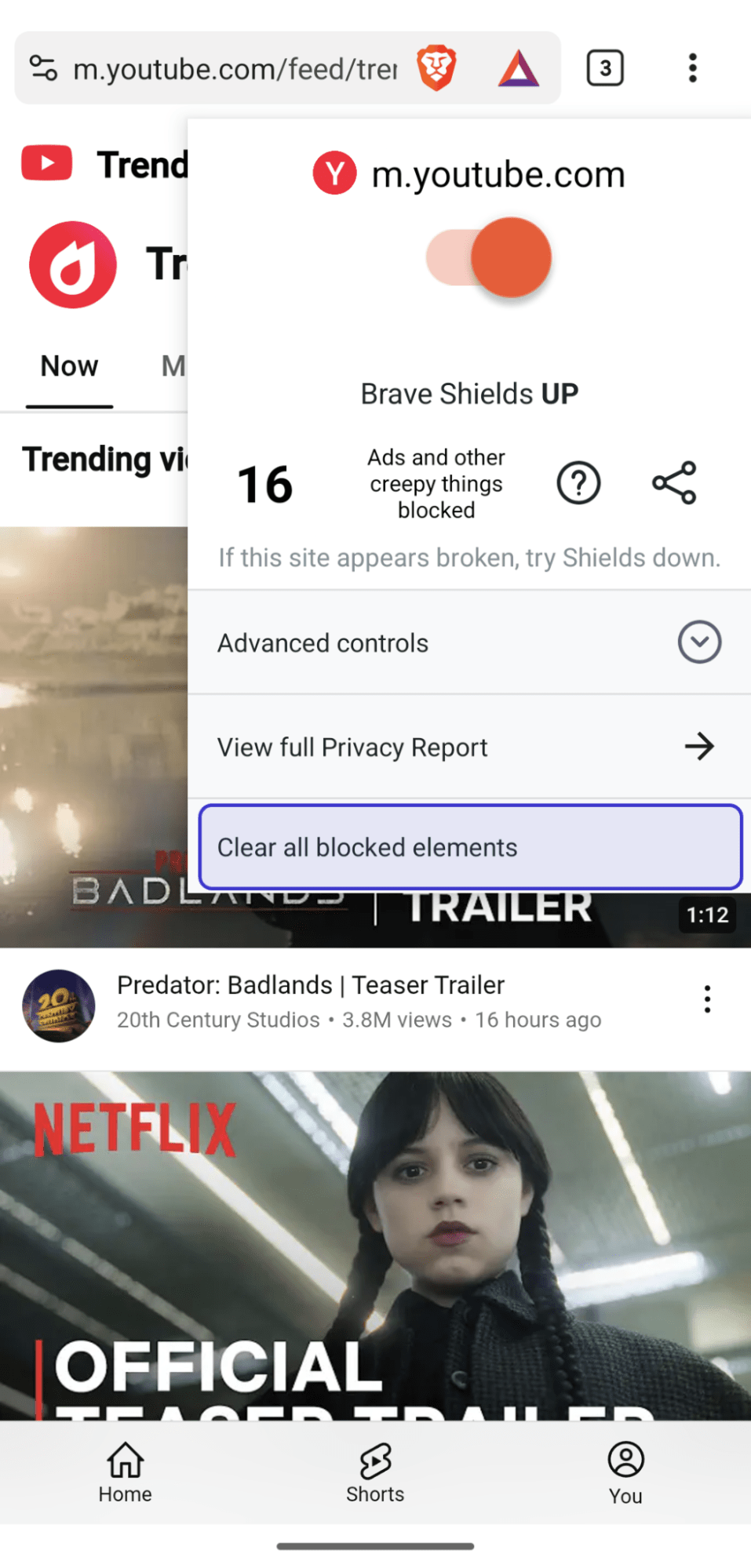 Brave Shields menu expanded on mobile, showing 'Clear all blocked elements' menu item